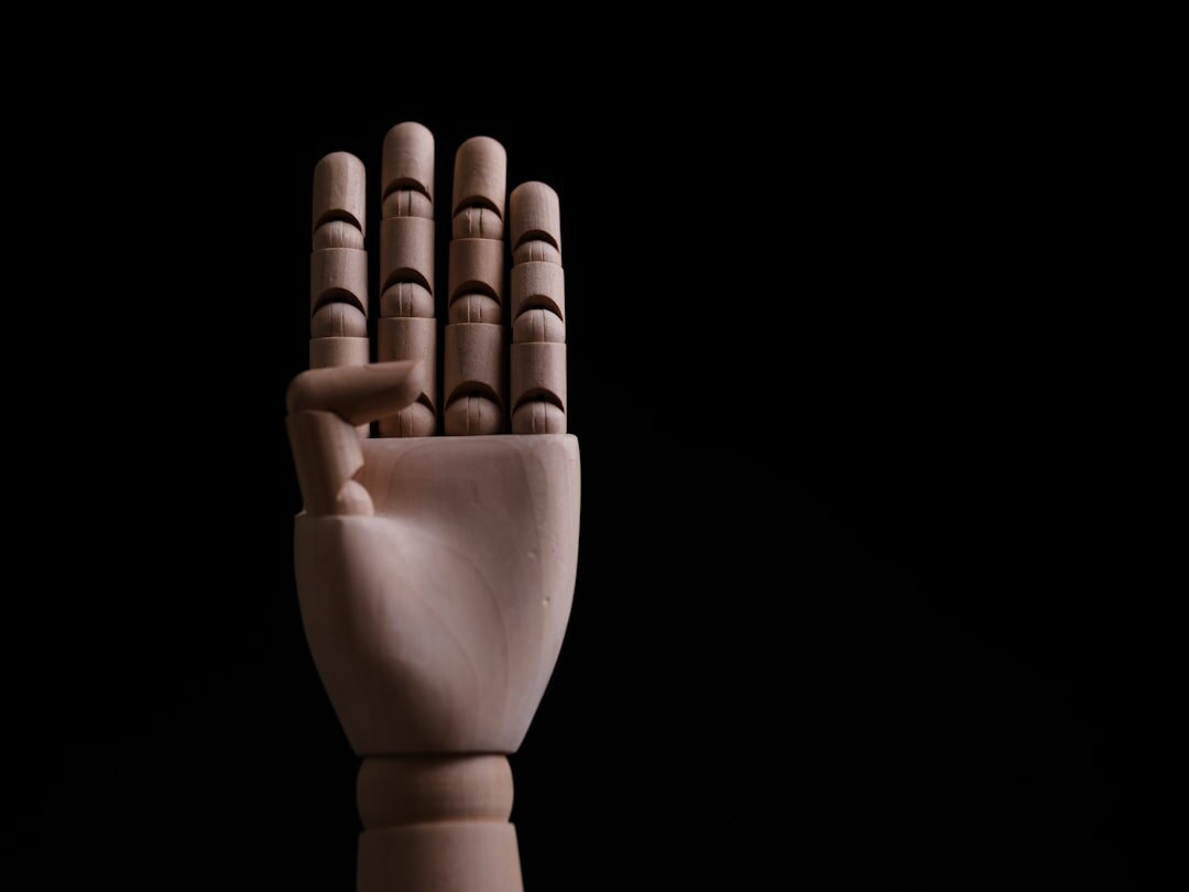 Artificial intelligence robot hand touching human hand